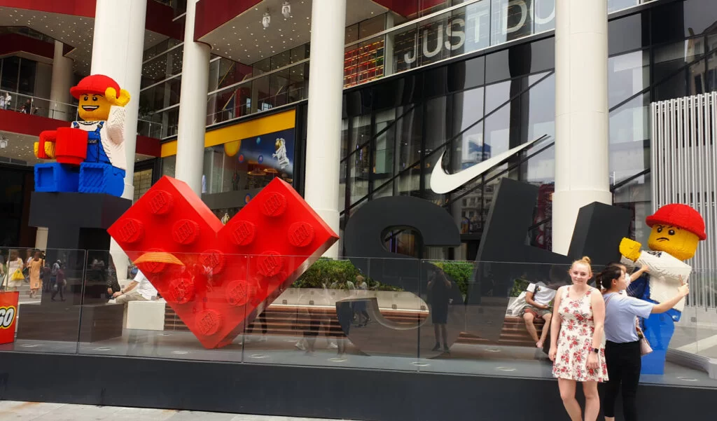 Zoe stood in front of the I heart Shanghai lego sign on Nanjing Shopping Street.