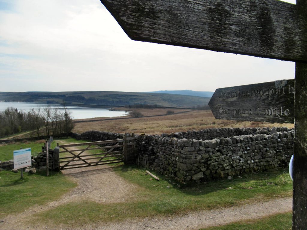 Turn left at this sign to walk back to the car park via Grimwith Reservoir's wall/dam