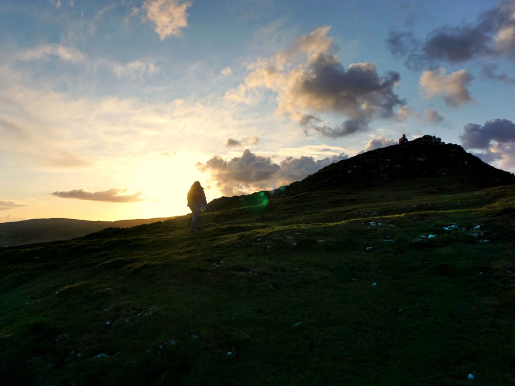 On the final uphill stretch to the peak of Chrome Hill against the glowing sunset in the Peak District