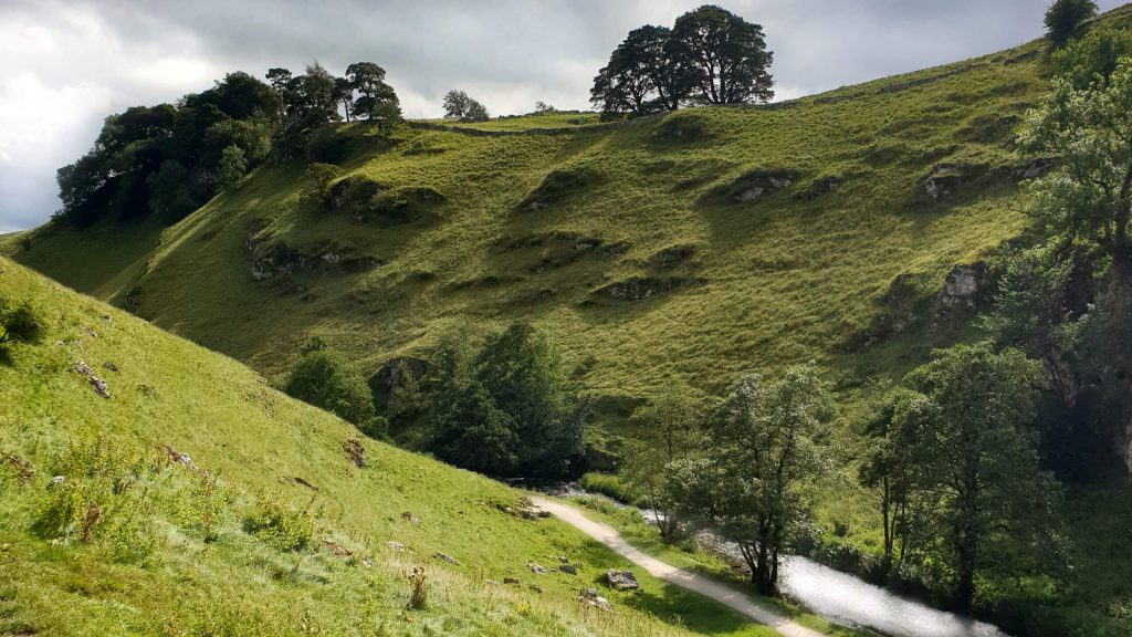 The enchanting Wolfsote Dale with it's steep, rocky valley and the River Dove running through the centre - an essential part of this Hartington walk.