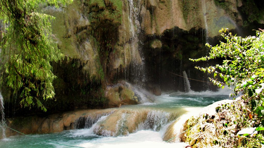 One of the many waterfalls at Pozas Azules de Atzala, with the agua blue water below