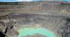 Inside the crater of Santa Ana Volcano is a bright green sulphurous lake. The crater walls are brown, gray and red from thousands of eruptions over the years