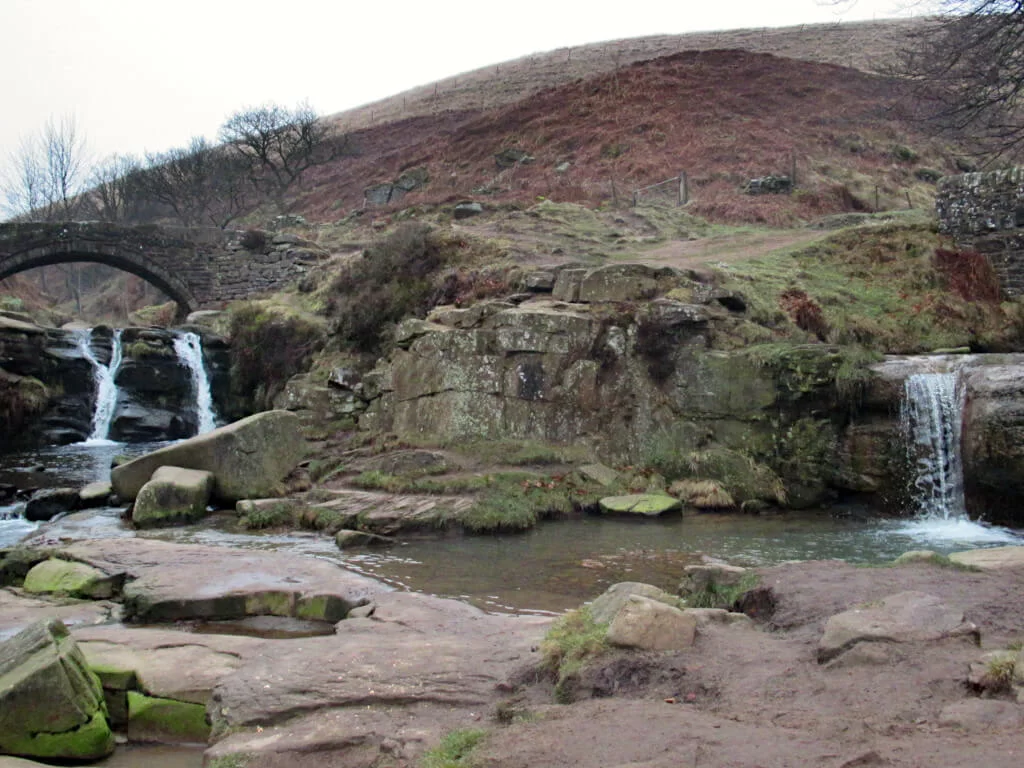 The two parts of Three Shires Head where two rives meet. Small waterfalls flow from each river