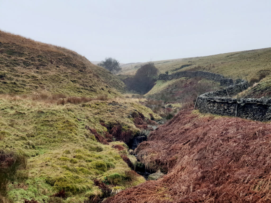 Looking over the misty Peak District with winter tones