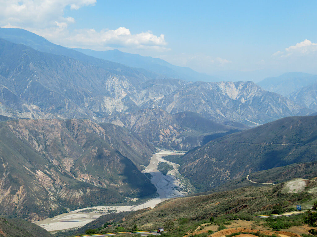 The Chicamocha river runs through the centre of the canyon with the walls rising steeply