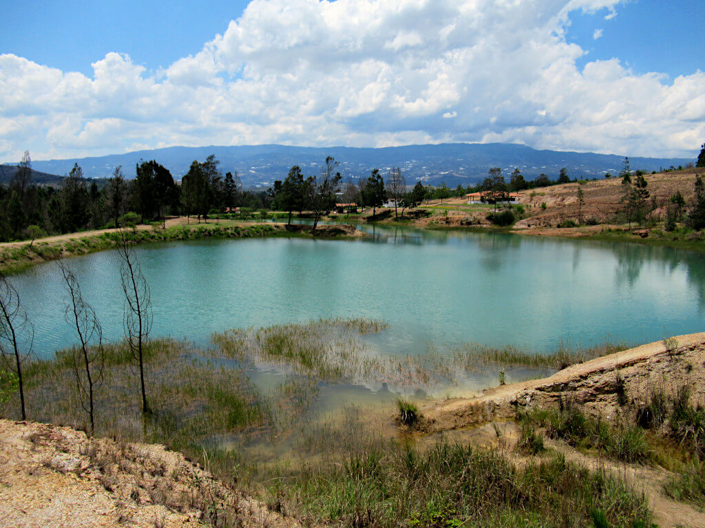 Perhaps the largest of the wells at Pozos Azules Villa de Leyva with the rolling hills behind