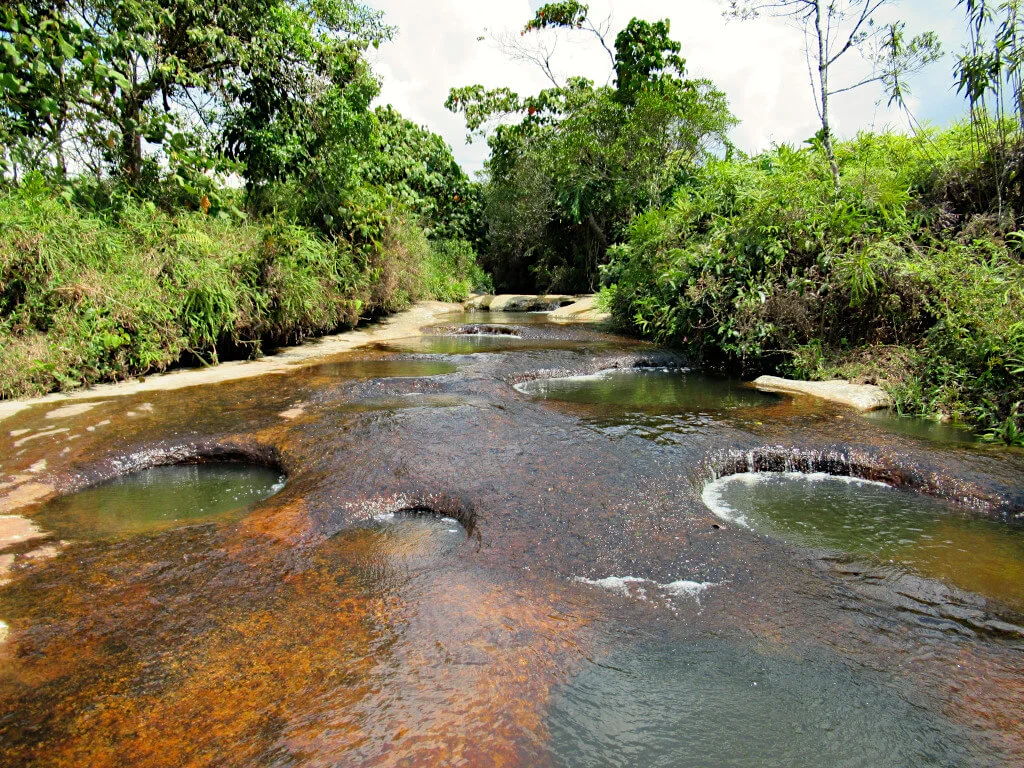 The unique plunge pools of Las Gachas with the vibrant colours of the riverbed clearly visible