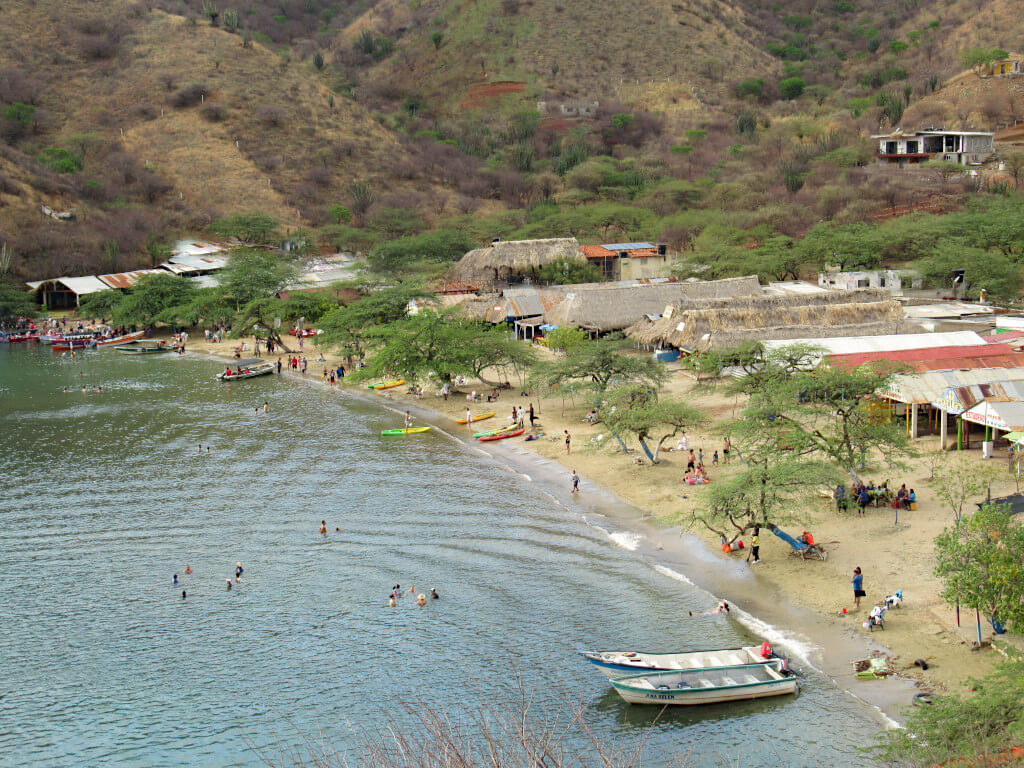 Playa Grande has fewer boats but possibly more litter. The beach is lined with small buildings serving food and drinks