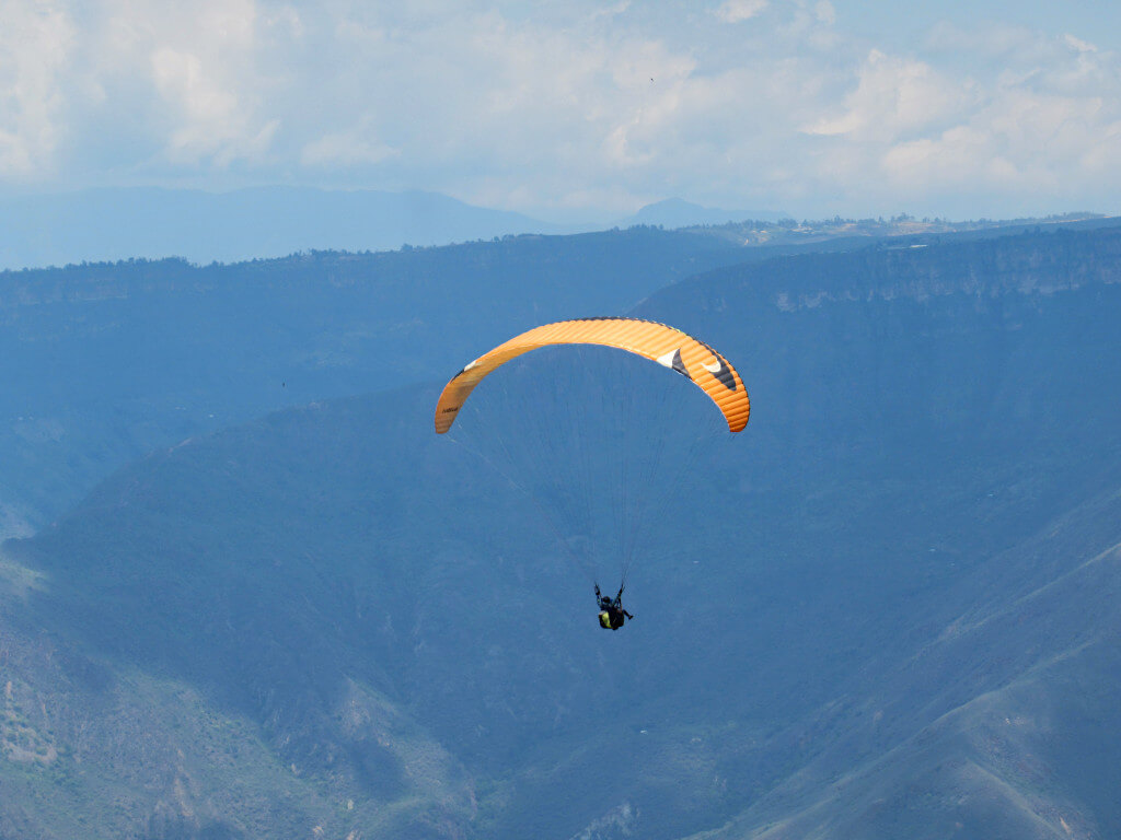 Paragliding in the Chicamocha Canyon against the tall valley walls