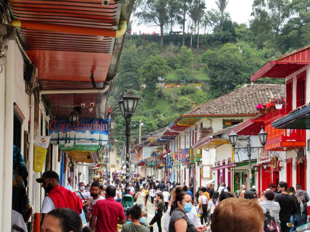 The busy streets of Salento Quindio, filled with visitors on weekends and national holidays. The streets are packed with people visiting the bright buildings
