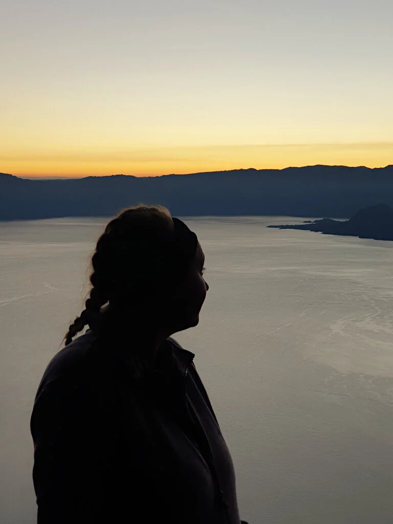 Zoe looking out over Lake Atitlan from Indian Nose at sunrise