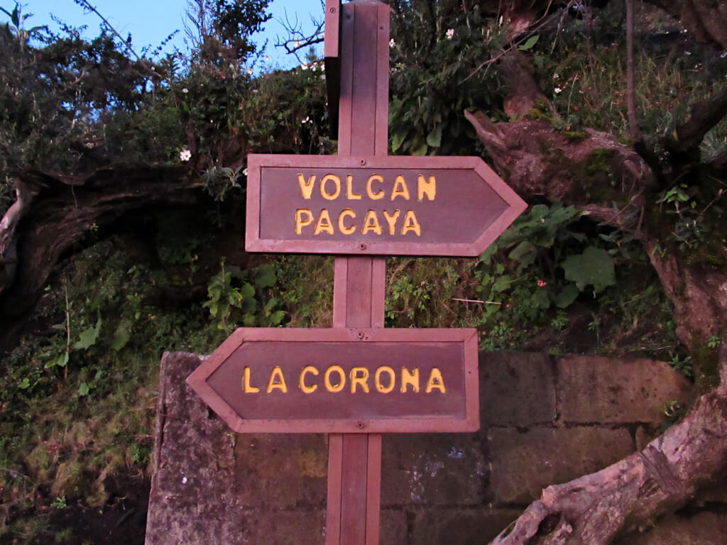 Sign pointing towards Pacaya Volcano as well as La Corona, which means the crown in Spanish
