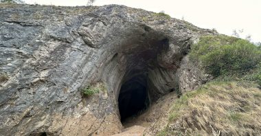 Thor's Cave entrance on the side of a cliff