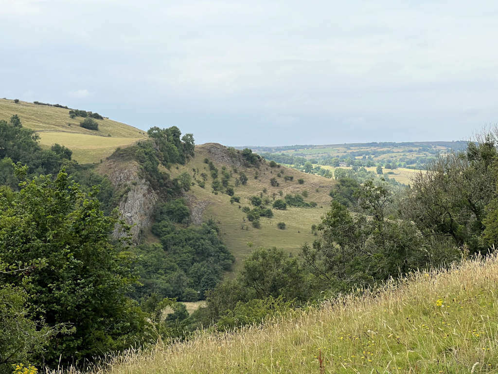 Overlooking the beautiful Peak District countryside where this Thors Cave walk continues