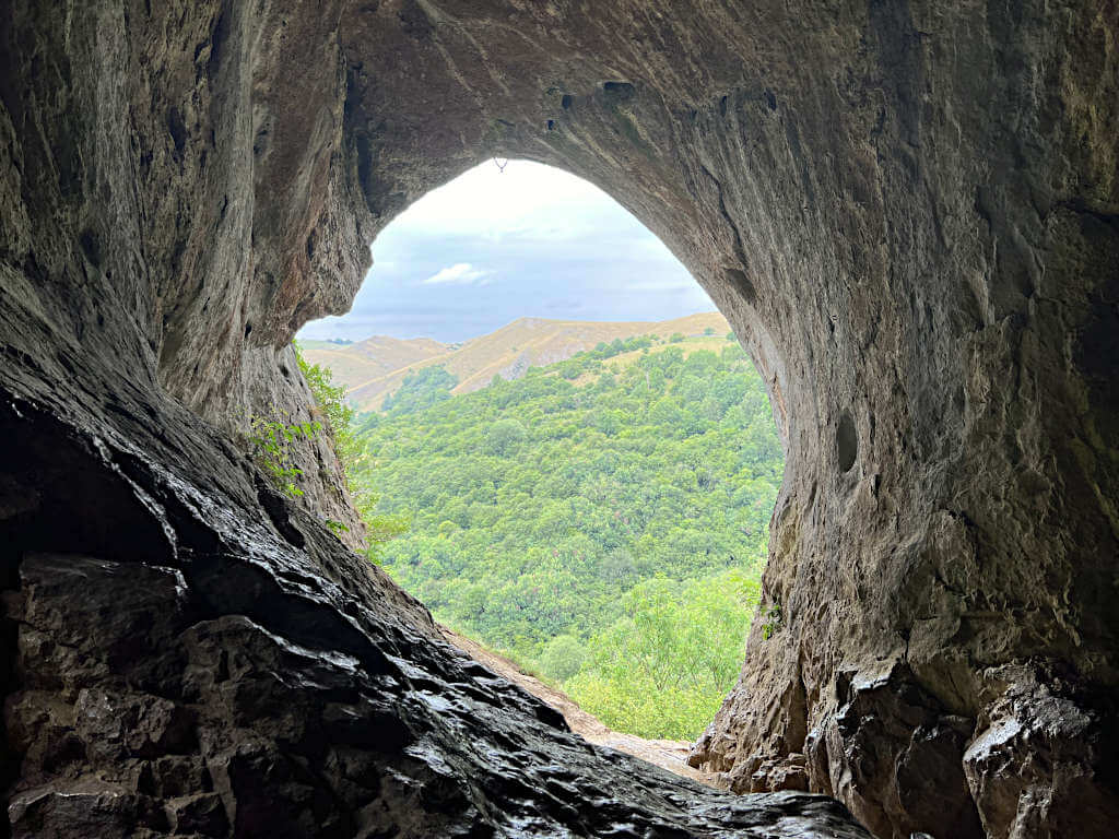 Looking out from Thor's Cave with the rock striations visible