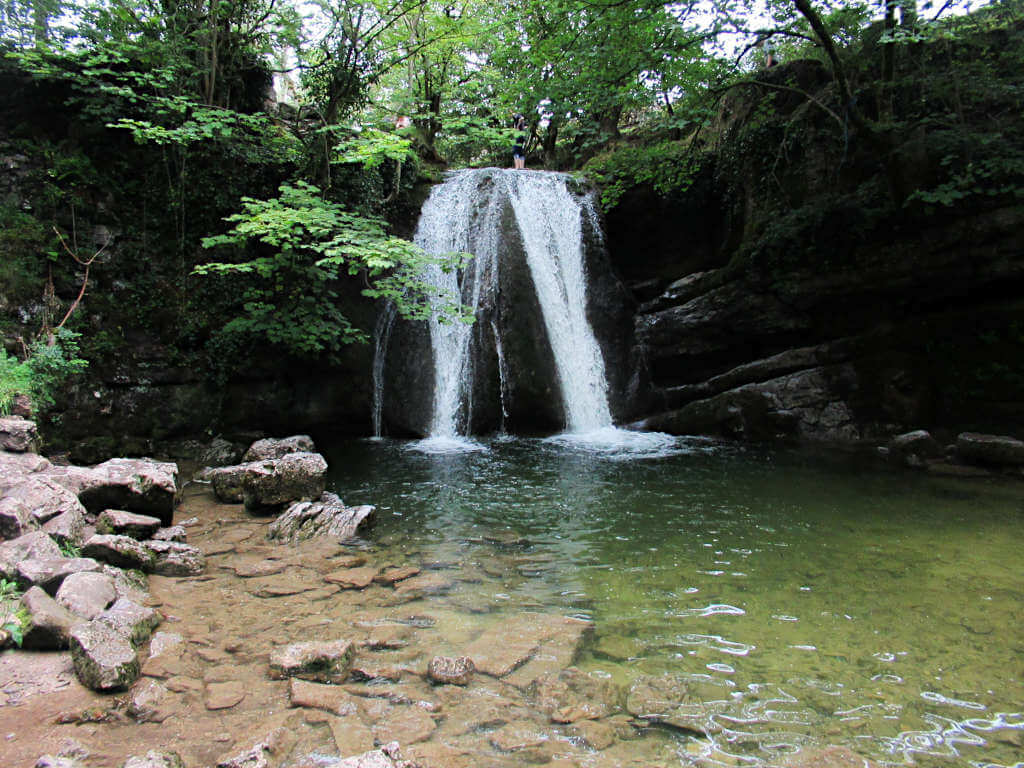 Janet's Foss Waterfall is a popular spot in the summer months with it's clear water and leafy surroundings
