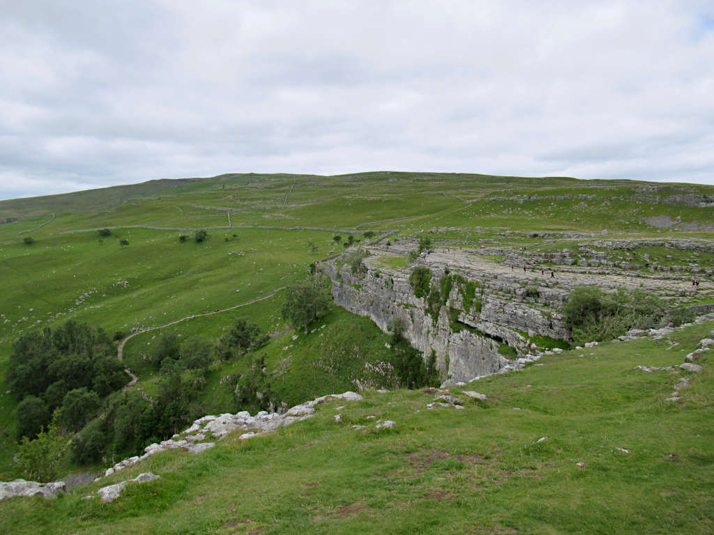 Looking along the steep rocky edge with the limestone pavement visible