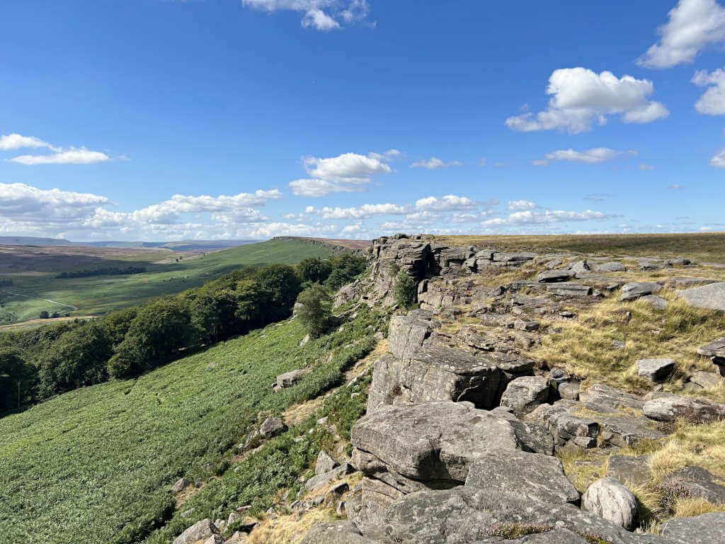Looking along Stanage Edge Peak District with the sheer cliff edge visible