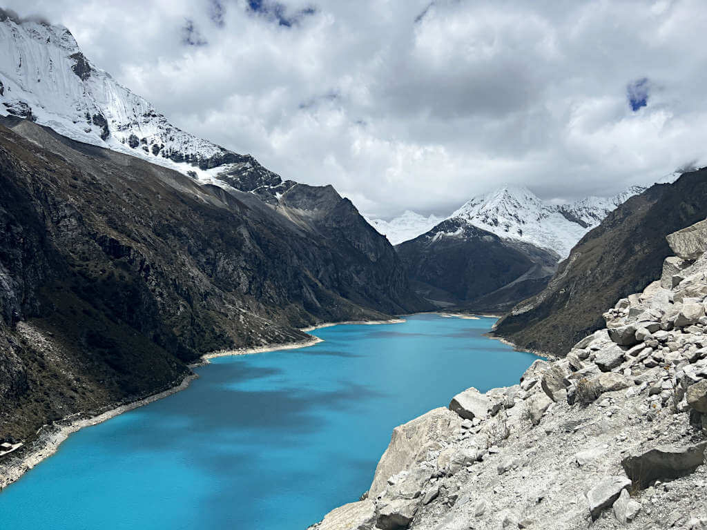 The majestic blue colour of Laguna Paron under snow-capped mountains