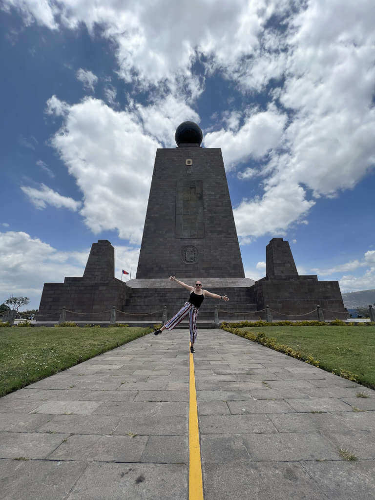 Zoe stood balanced on one leg on the Ecuador equator line