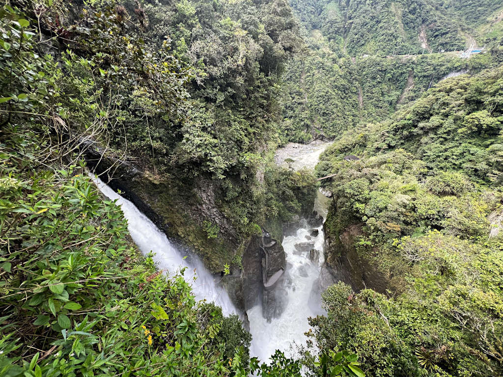 The Pailón del Diablo waterfall surrounded by lsuh greenery and its own unique ecosystem