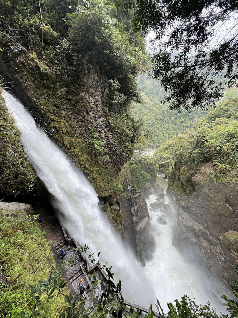 Looking down on Pailon del Diablo, the huge 80-metre-tall waterfall is on the left with the stairs in the rock behind