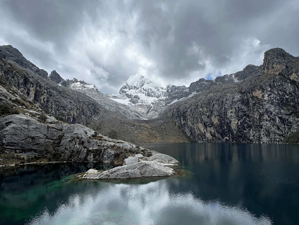 Looking across the lake towards the rocky peak