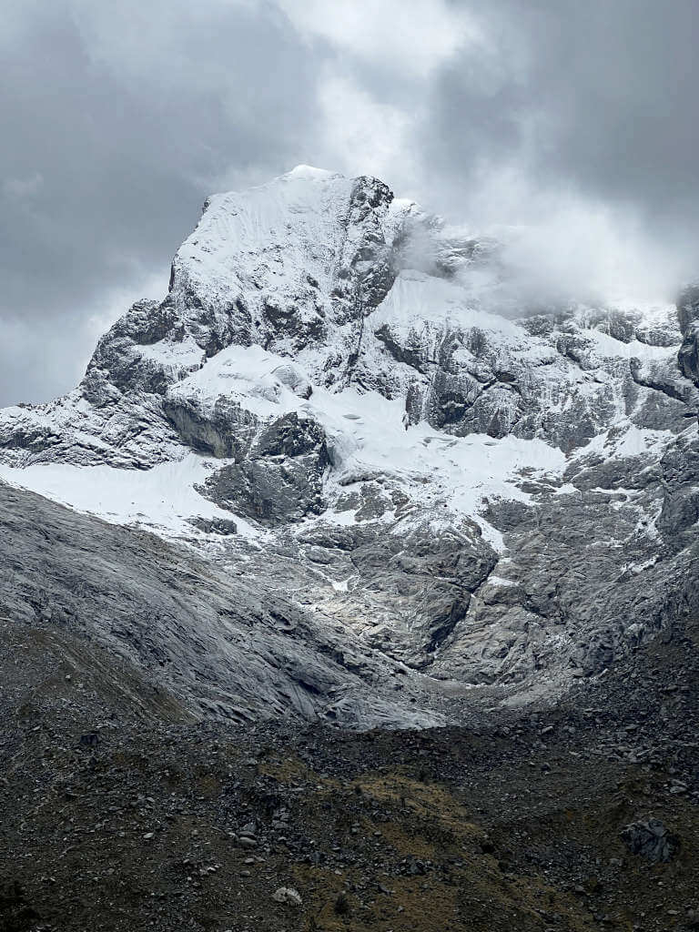 Gloomy skies set in around Nevado Churup, a rough snow-capped peak