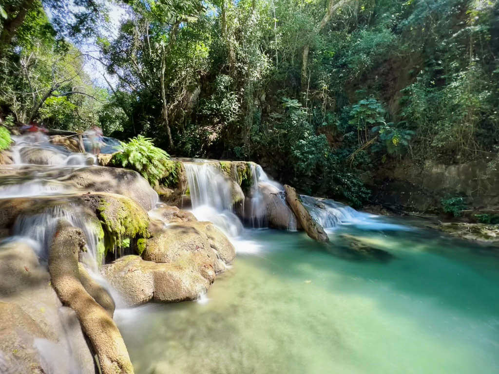 A little known Mexico Waterfall, these small waterfalls are beautiful nevertheless with turquoise green waterfall and a cascading fall along the river