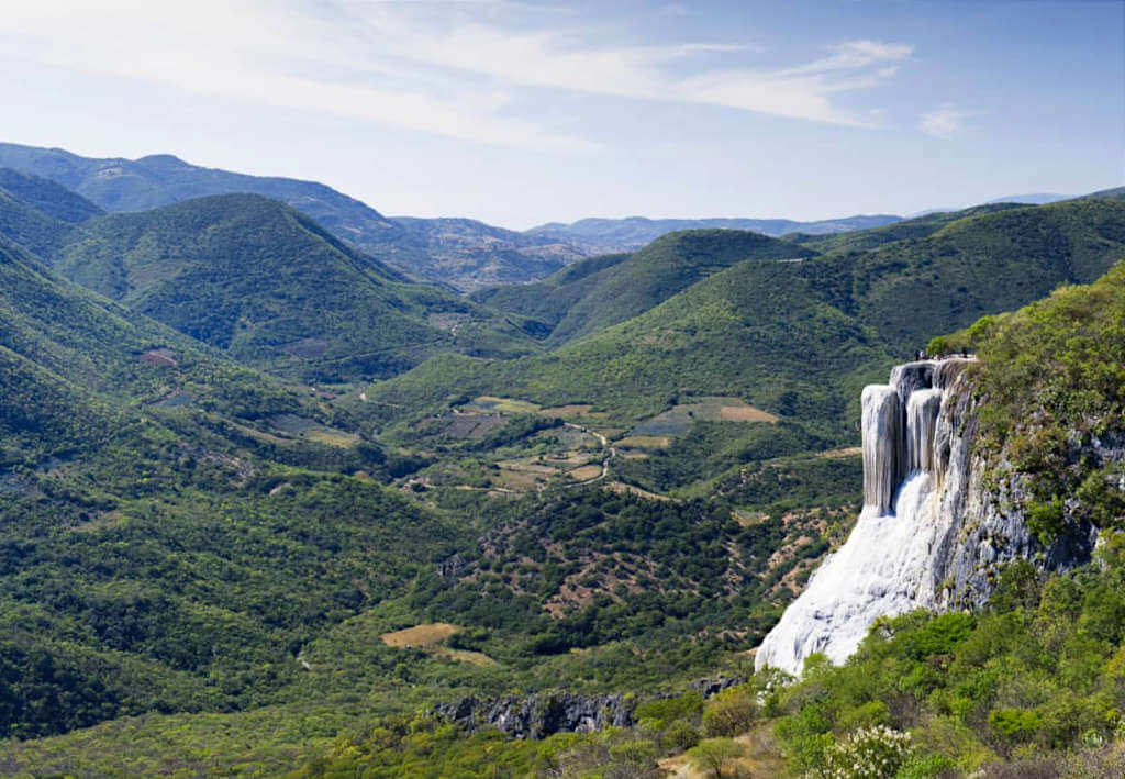 The petrified waterfalls of Hierve del Agua seen against the backdrop of the Oaxacan countryside in central Mexico