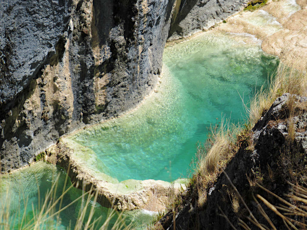 Top down view of the turquoise pool at Millpu Lagoons