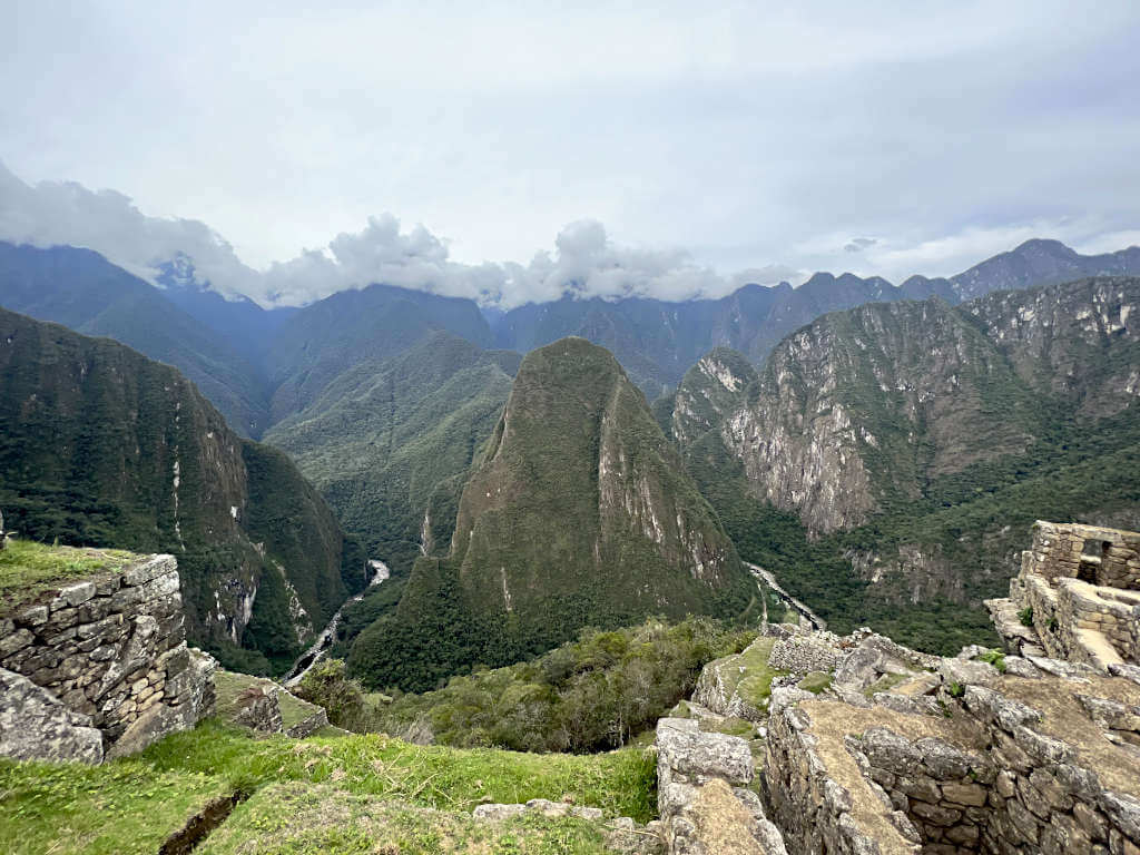 Looking out over the surrounding mountains and low clouds from the inca city ruins