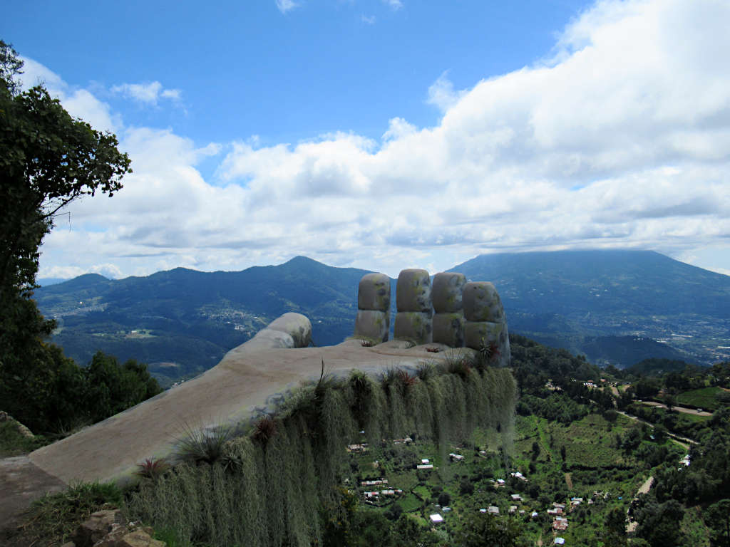 The Hobbitenango Hand viewpoint and phot spot with Volcano Agua hidden behind the clouds.