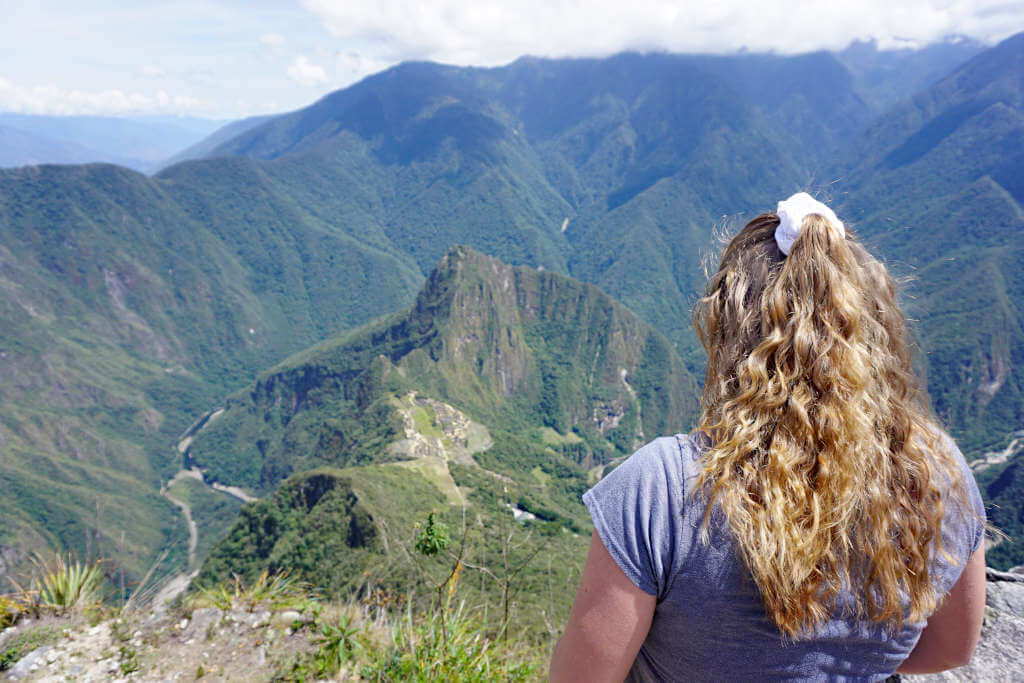 Zoe stood with her back to the camera looking down on the famous Inca ruins 600 metres below