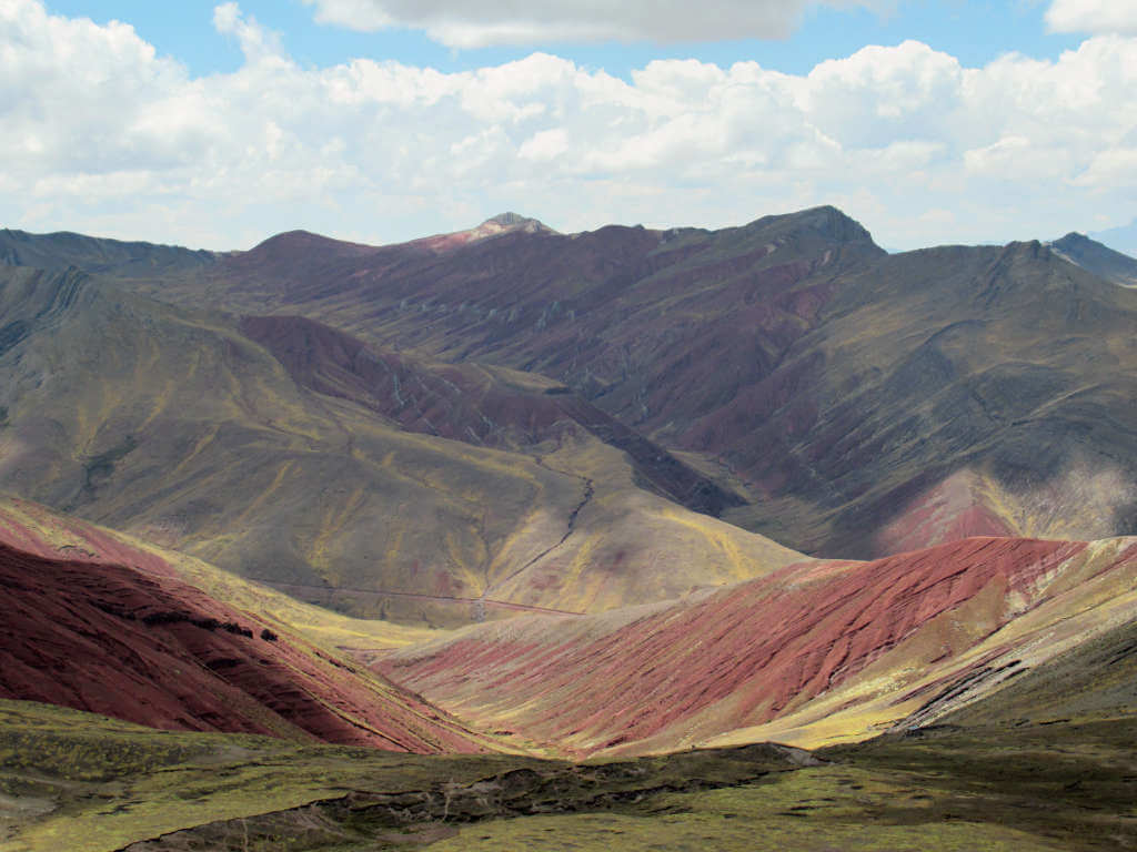 Looking out over the endless mountains all tinged with colours of the rainbow