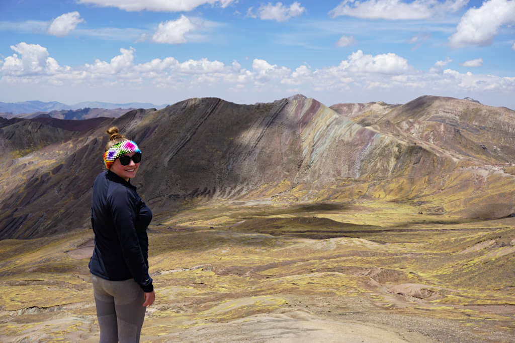 Zoe stood in front of the sprawling mountain range around Rainbow Mountain and the alternative rainbow mountain