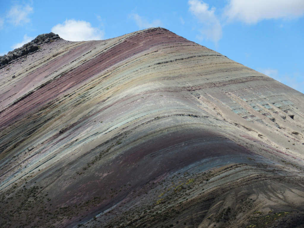 The vibrant colours of Palcoyo Mountain part of the rainbow mountain area south of Cusco, Peru