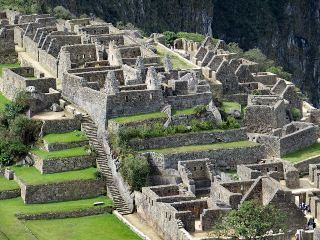 A close-up shot of the ruins at Machu Picchu with the remains of house-like structures