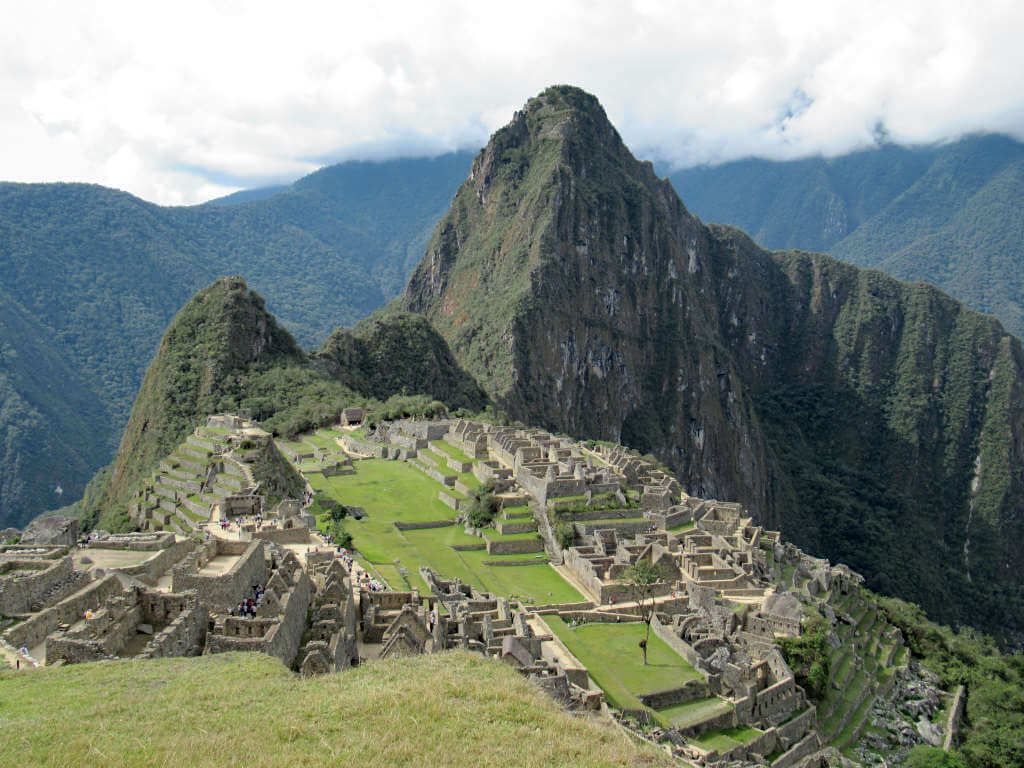 Once you make the journey from Cusco to Machu Picchu, you'll be rewarded with these magnificent views of the citadel, high in the Andes Mountains. The iconic peak of Huayna Picchu sits above the ruins