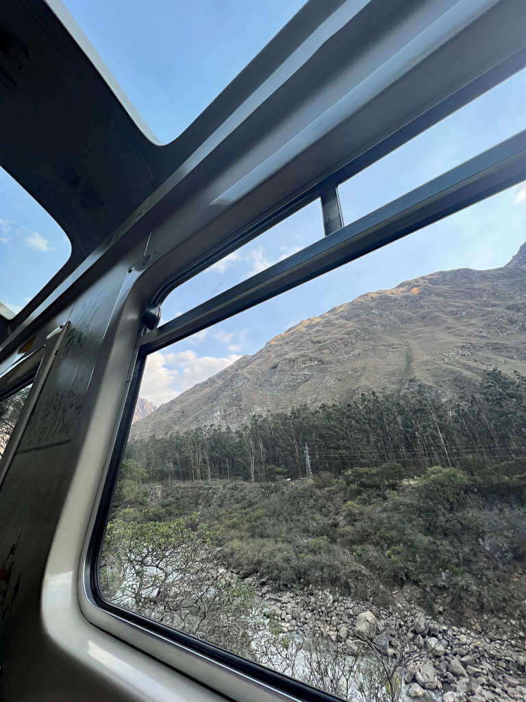Looking out the train window on the journey from Machu Picchu to Cusco. Windows in the ceiling mean you get a much wider view of the beautiful mountains