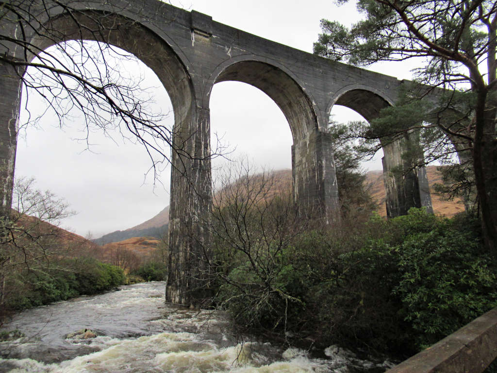 Looking up at Glenfinnan Viaduct from the path and river below