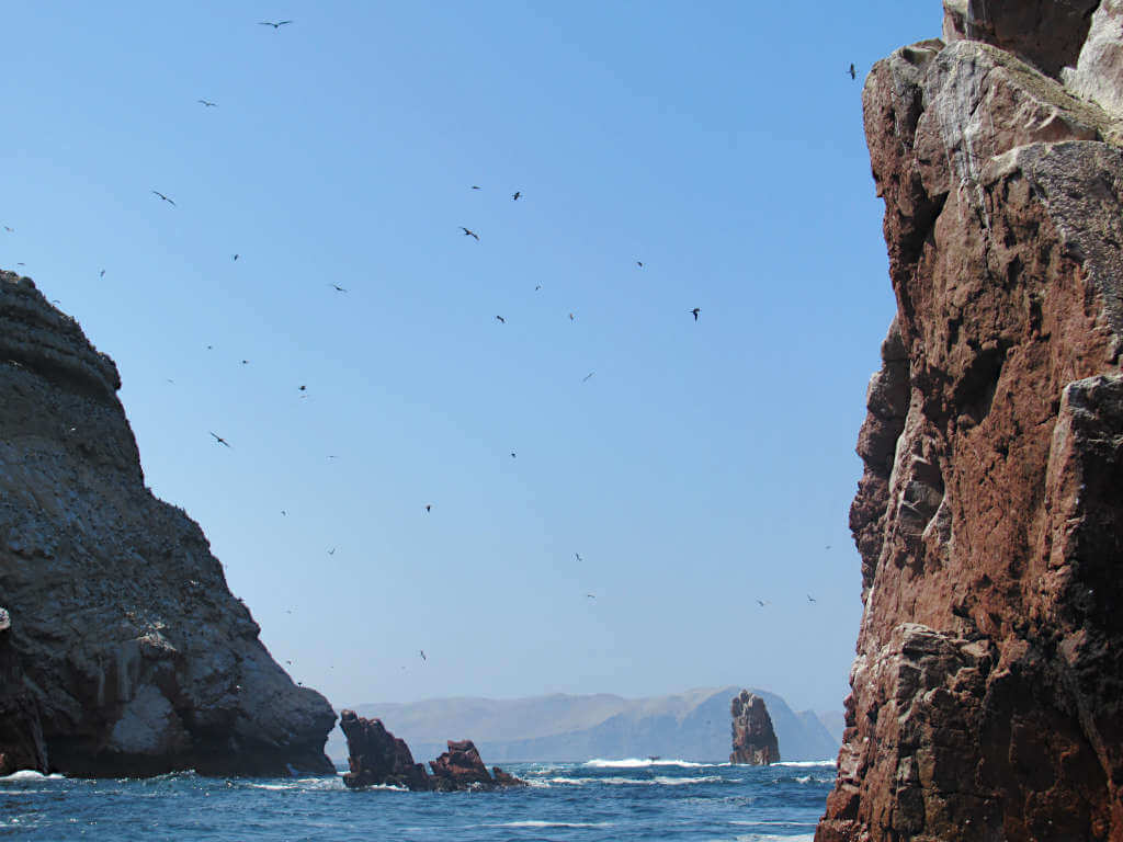 Looking through the rocky cliffs of the Poor Man's Galapagos Peru towards the mainland