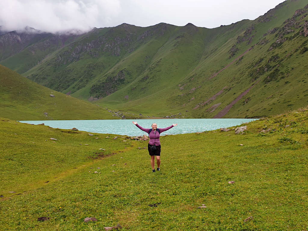 Zoe stood in front of Kol Tor Lake - the focal point of this hike in Kyrgyzstan