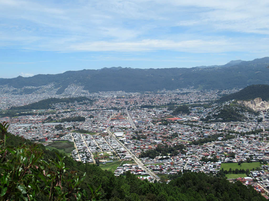 Looking out over San Cristobal from a hilltop viewpoint, the city fills the whole valley