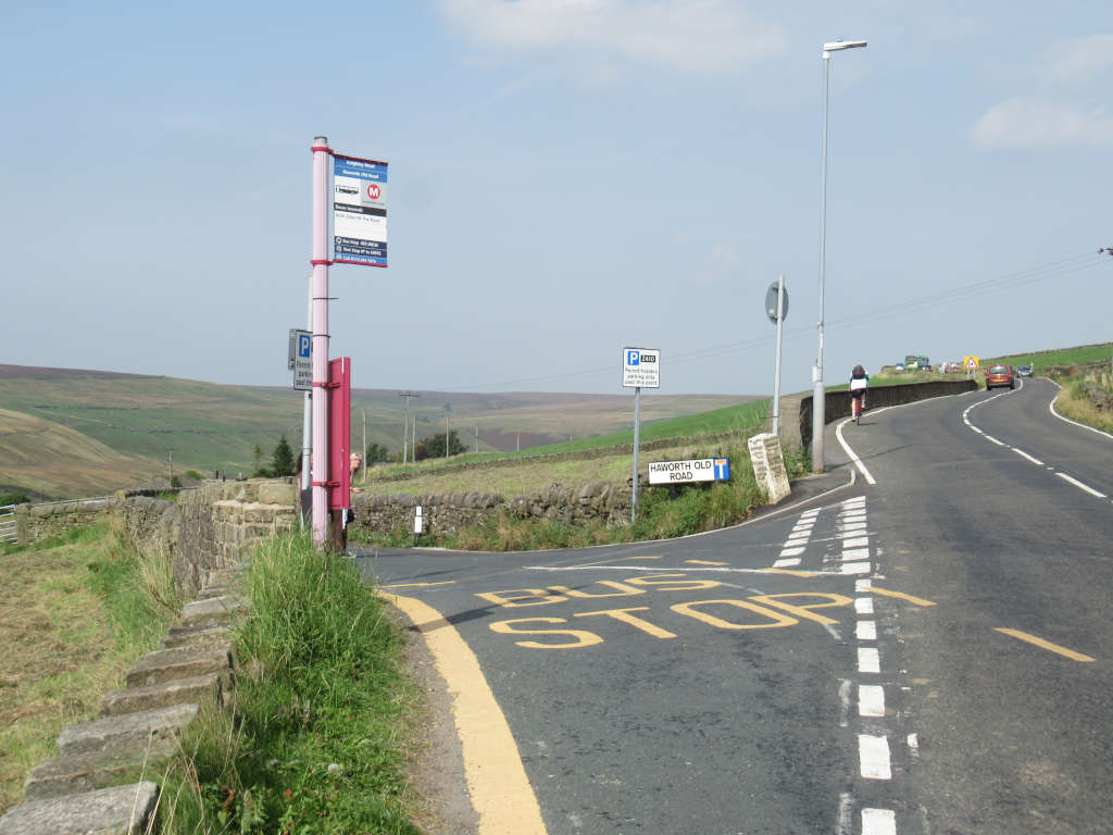 The junction of Old Road (where the path to Lumb Falls is) and the A6033 to Hebden Bridge, with the bus stop located on the corner