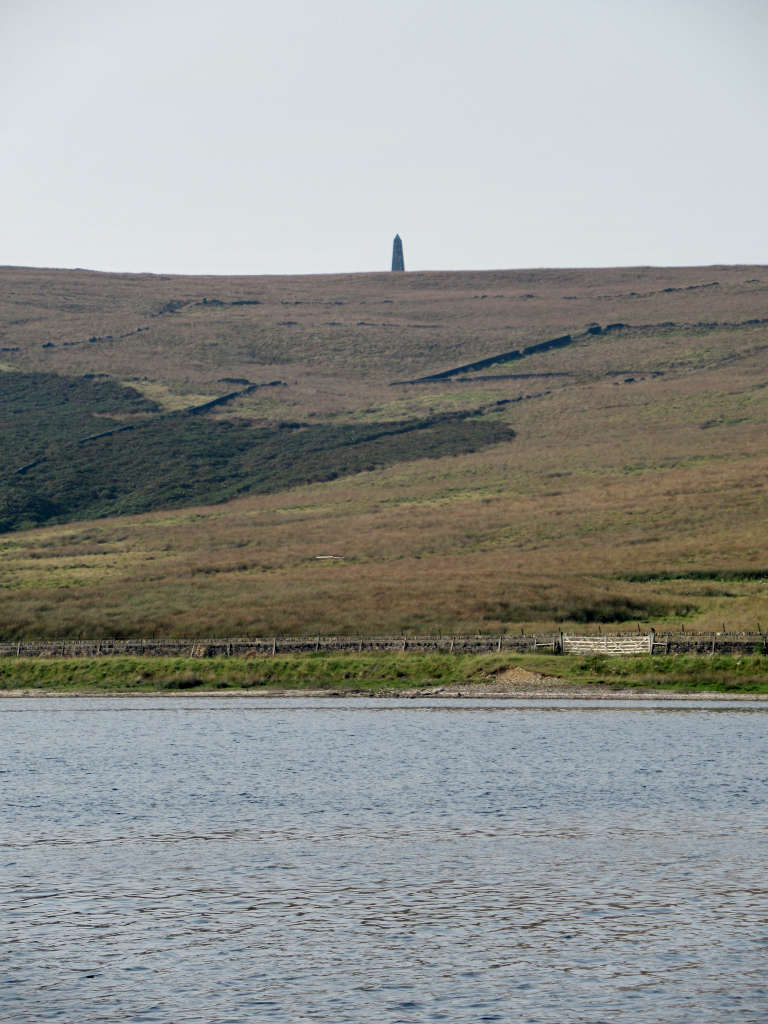 Stoodley Pike on the top of the hill overlooking the water