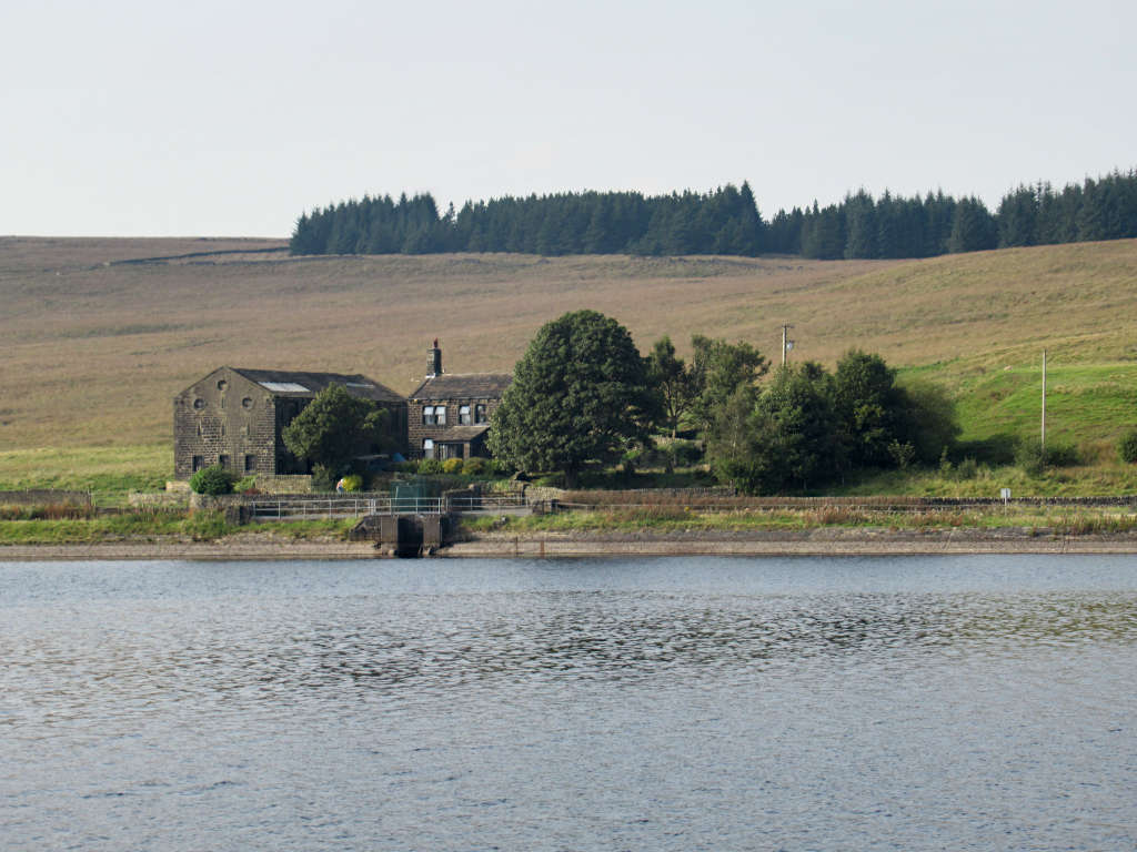 A house on the shores of Withens Clough Reservoir